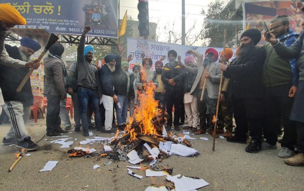 On Lohri, farmers burn copies of new farm laws