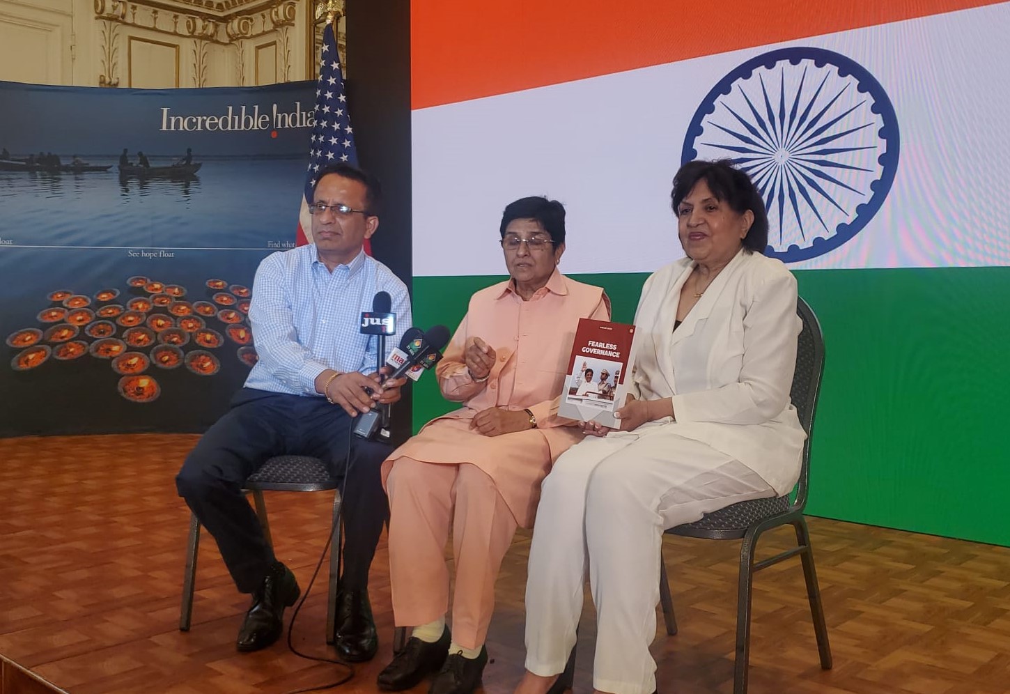 Dr Kiran Bedi presents her book to Indian Consul General Randhir Jaiswal