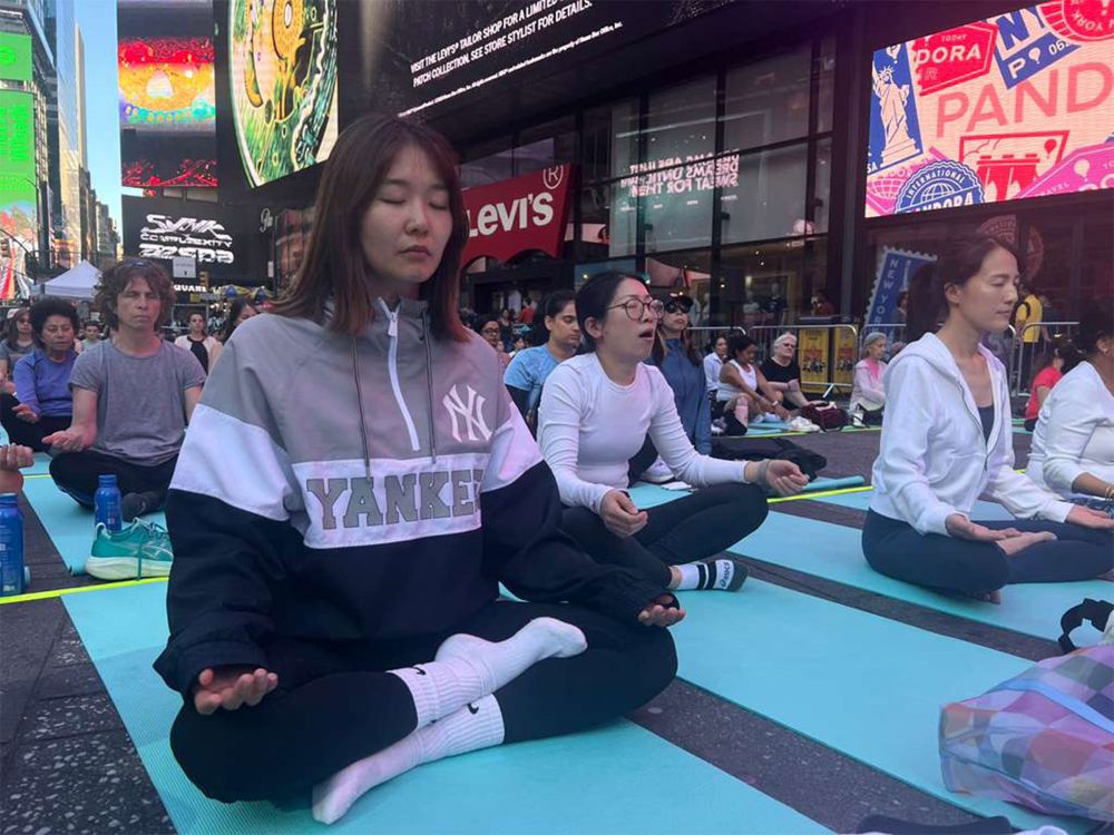 Om chants echo across Times Square on International Yoga Day
